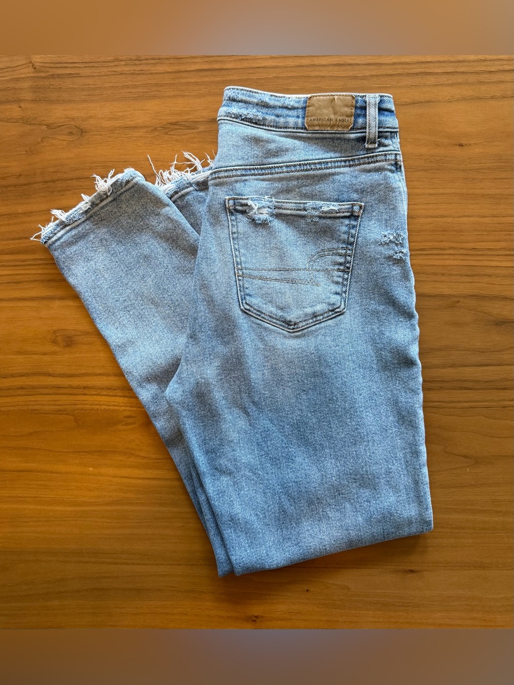 American Eagle Light Wash Frayed Hem Jeans